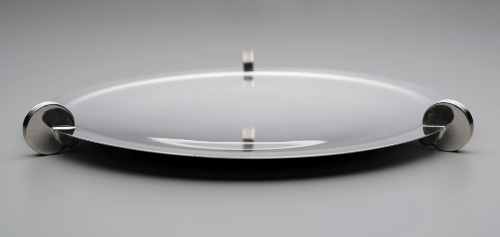 Discus canapé tray by Lurelle Guild